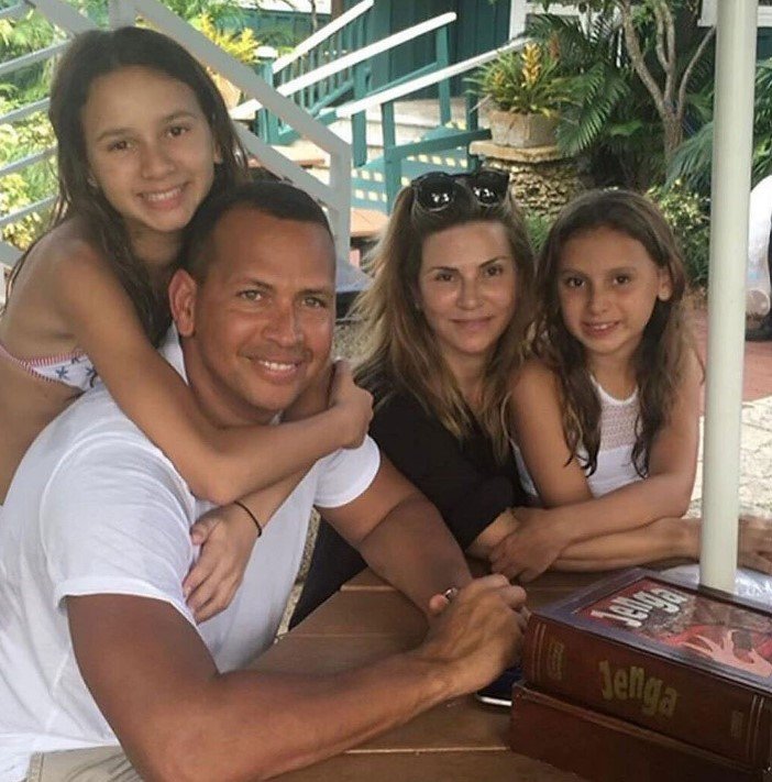Cynthia Scurtis with her ex husband and daughters